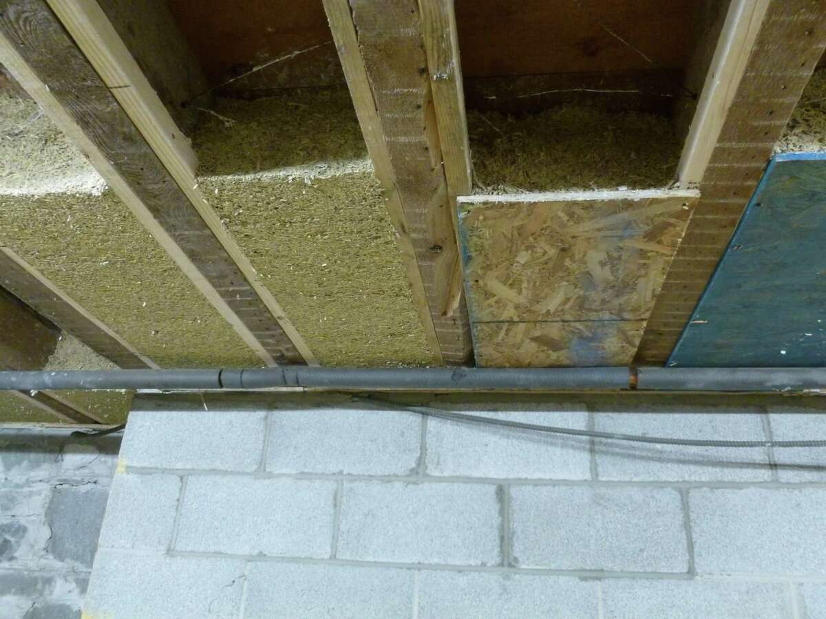 Hempcrete insulation is applied between the joists in Jim Savage's renovated 1850s farmhouse in Stuyvesant, Columbia County.