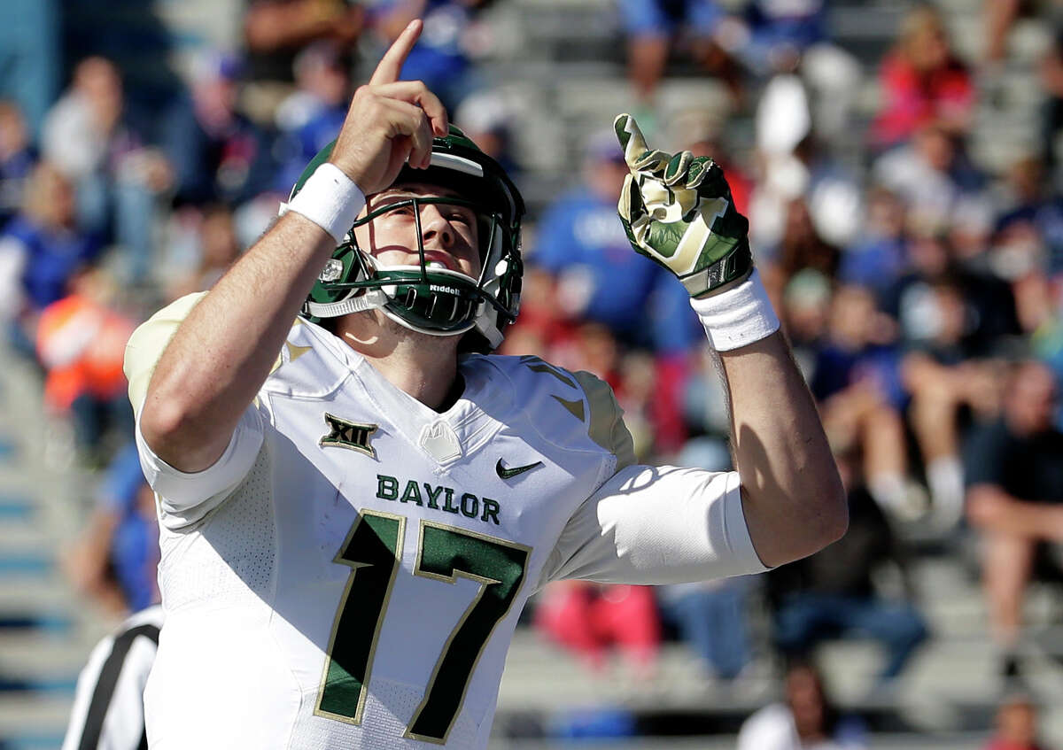 Baylor quarterback Seth Russell (17) celebrates after scoring a touchdown during the first half of an NCAA college football game the Kansas Saturday, Oct. 10, 2015, in Lawrence, Kan. Baylor won 66-7.