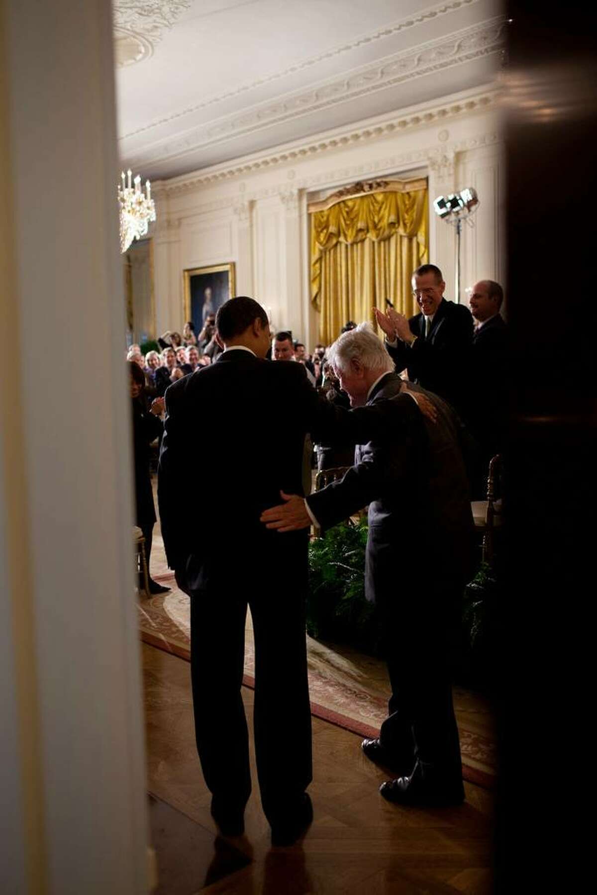 President Barack Obama and Sen. Edward Kennedy, D-Mass., enter the East Room of the White House, to attend a Health Care Summit with members of Congress, March 5, 2009. (Official White House Photo by Pete Souza) This official White House photograph is being made available only for publication by news organizations and/or for personal use printing by the subject(s) of the photograph. The photograph may not be manipulated in any way and may not be used in commercial or political materials, advertisements, emails, products, promotions that in any way suggests approval or endorsement of the President, the First Family, or the White House.