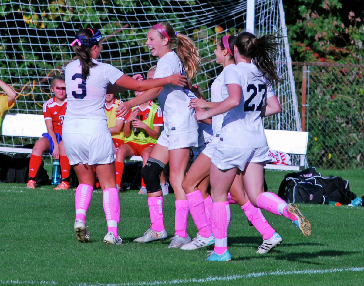 Staples players celebrate scoring a goal against New Canaan on Tuesday, October 13, 2015 in Westport Connecticut. The Wreckers won 4-1.