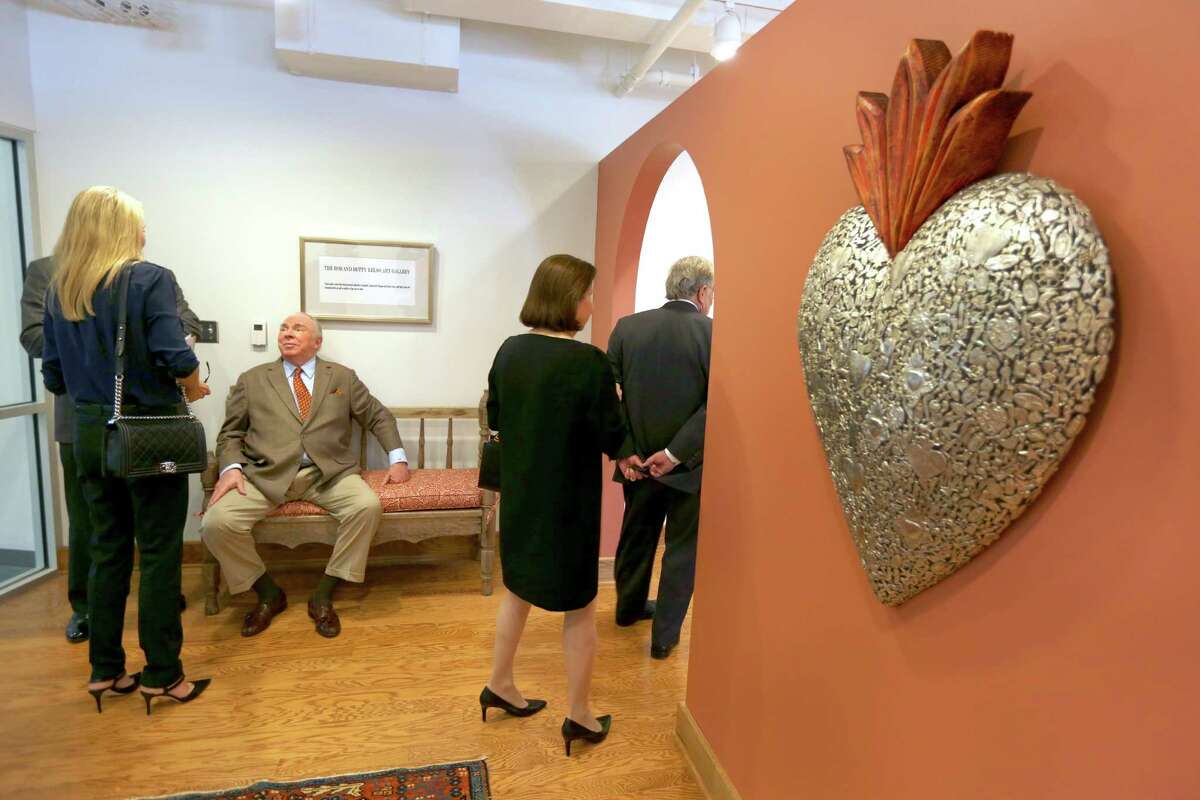 University of Incarnate Word benefactor Robert Kelso, seated, talks to visitors to the Betty and Robert Kelso Art Gallery inside the Kelso Arts Center building Wed., Oct. 14, 2015 after a ribbon cutting ceremony reopened the recently renovated Fine Arts Complex.