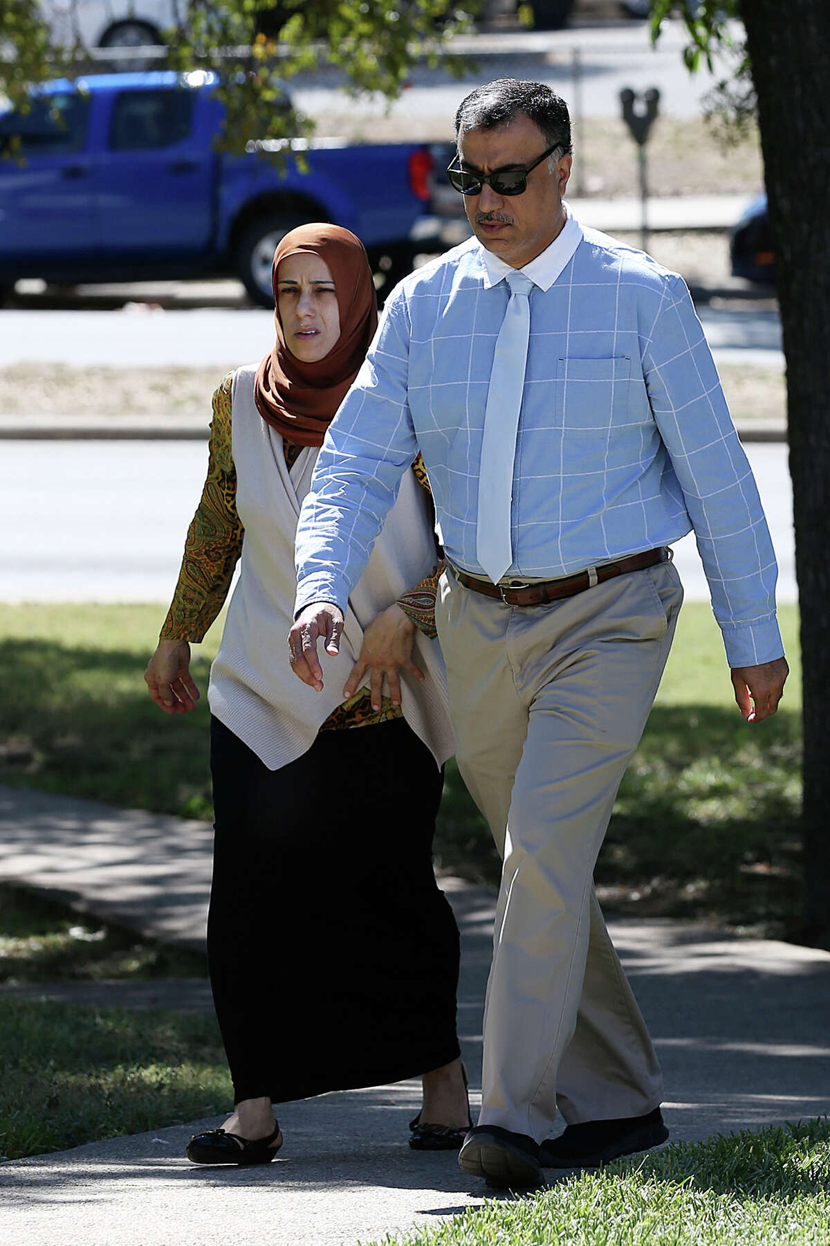 Qatar official Hassan Al Homoud and his wife, Zainab Al Hosani walk into Federal Court, Wednesday, Oct. 14, 2015. They are facing federal charges of forced labor. They are accused of keeping a female servant and a housemaid under inhumane conditions and not paying them a salary. The two women, one from Indonesia and the other from Bangladesh, arrived in San Antonio in June of 2014 from Qatar. They were each promised a monthly salary of $1,573.87.