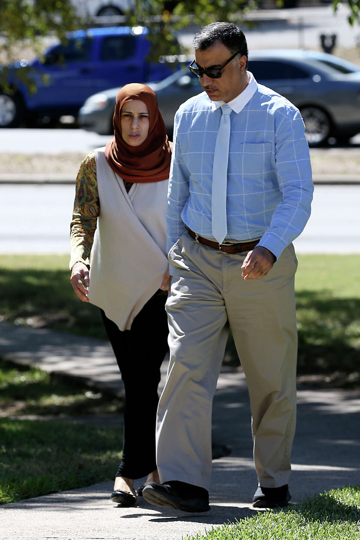 Qatar official Hassan Al Homoud and his wife, Zainab Al Hosani walk into Federal Court, Wednesday, Oct. 14, 2015.