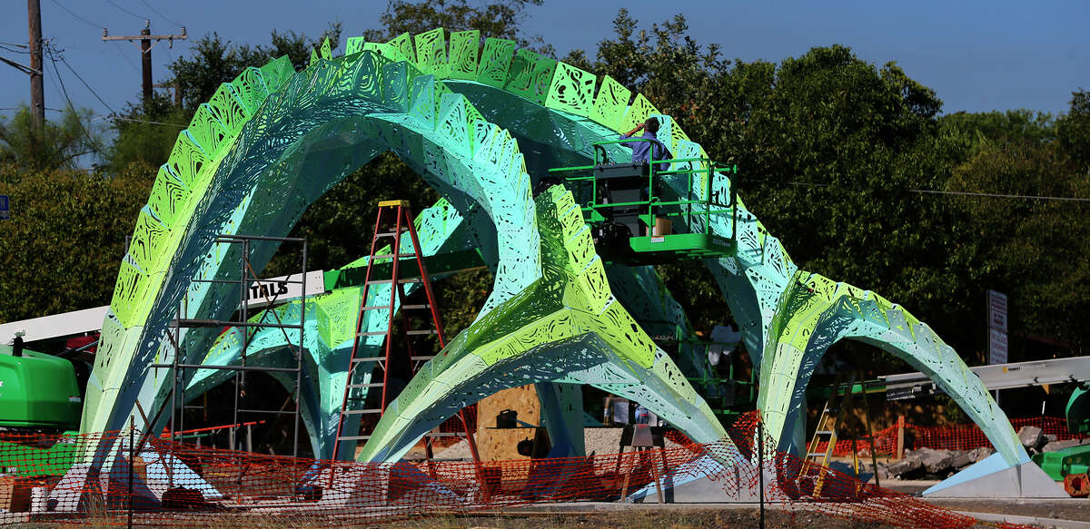 Randy Domeck of Indianapolis Fabrications assembles aluminum pieces of an art object Tuesday October 13, 2015 currently being constructed near Woodlawn Lake Park at the corner of South Josephine Tobin and Cincinatti. Designed by architect and artist Marc Fornes of the New York based studio THEVERYMANY, the canopy structure is composed of 1,000 pieces and 20,000 rivets according to Lance Pruitt of Indianapolis Fabrications. Pruitt said assembly of the mechanical structure should be completed by this Thursday.