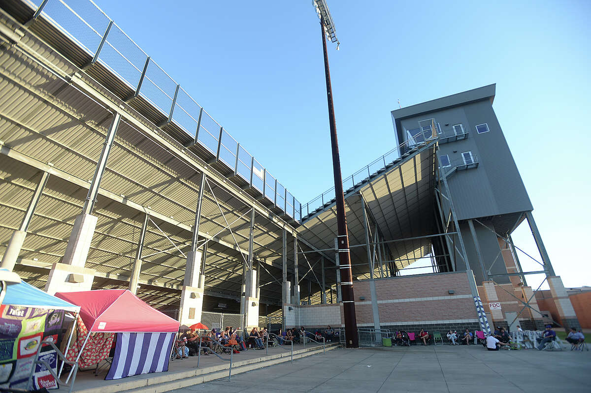 Port Neches - Groves fans line the stadium entrance Wednesday night to await the morning sale of tickets for the annual Mid-County Madness showdown with Nederland, which will be hosted at The Reservation this Friday. Photo taken Wednesday, October 14, 2015 Kim Brent/The Enterprise