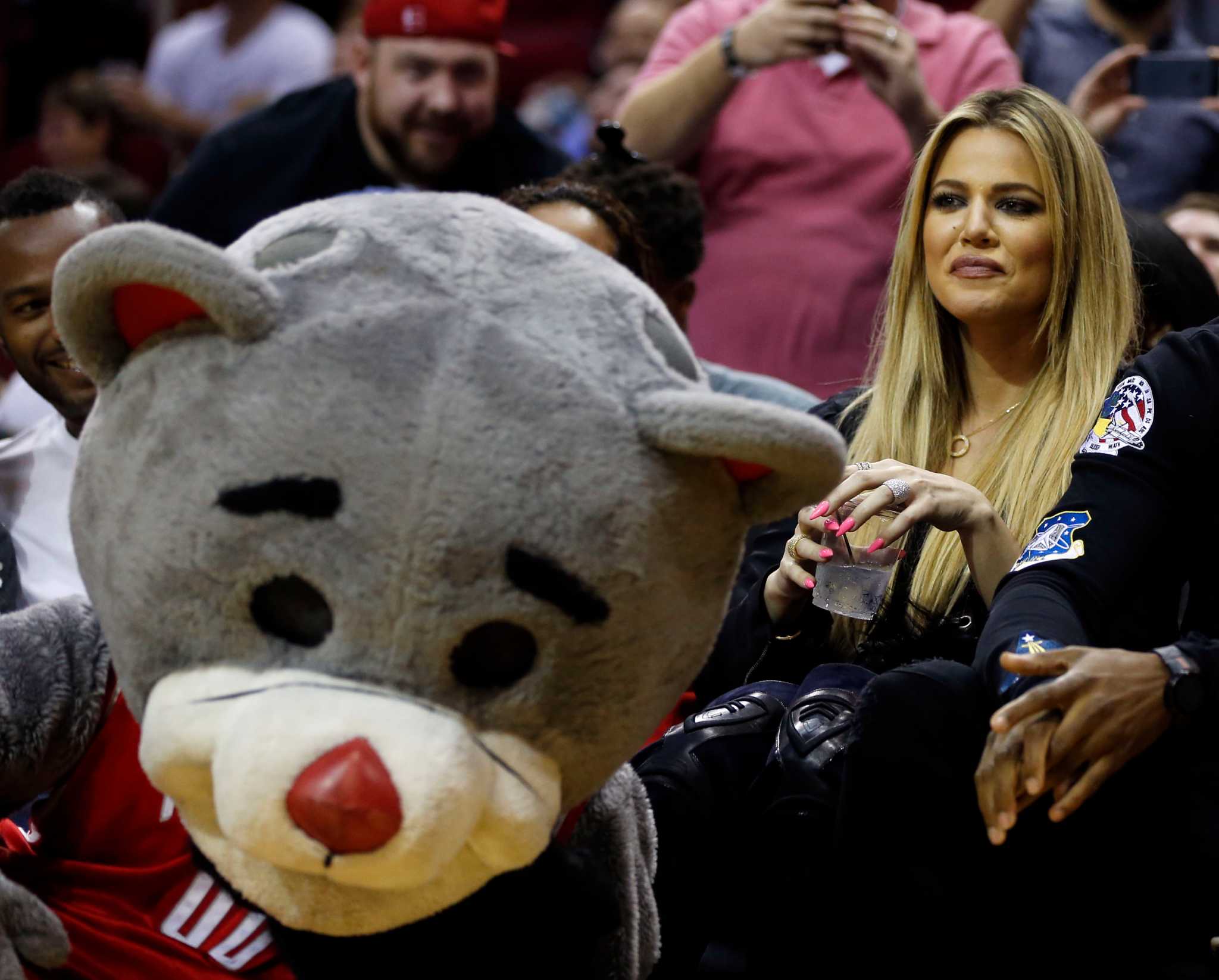 Hip hop performer Travis Scott cheers on the Houston Rockets before Game 2  of the team's first-round NBA basketball playoff series against the  Minnesota Timberwolves, Wednesday, April 18, 2018, in Houston. (AP