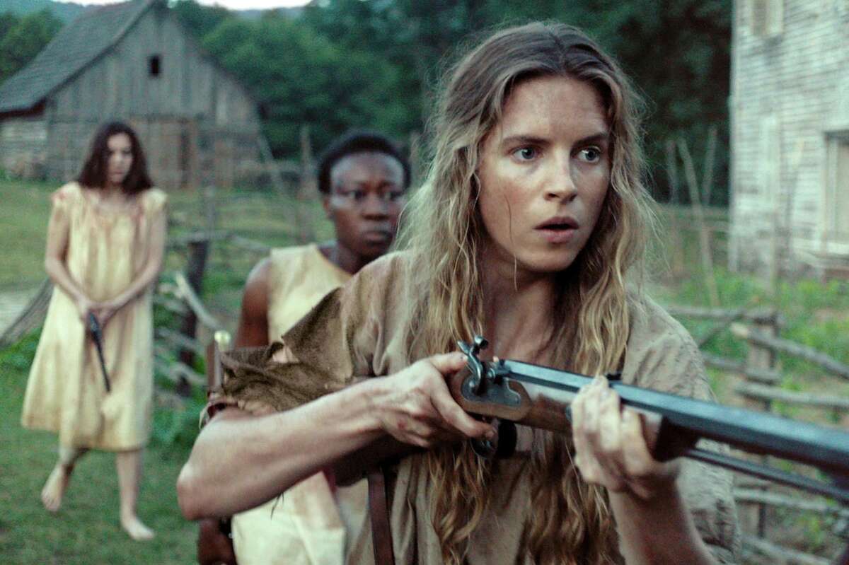 Brit Marling, from front, Muna Otaru and Hailee Steinfeld defend themselves in "The Keeping Room."
