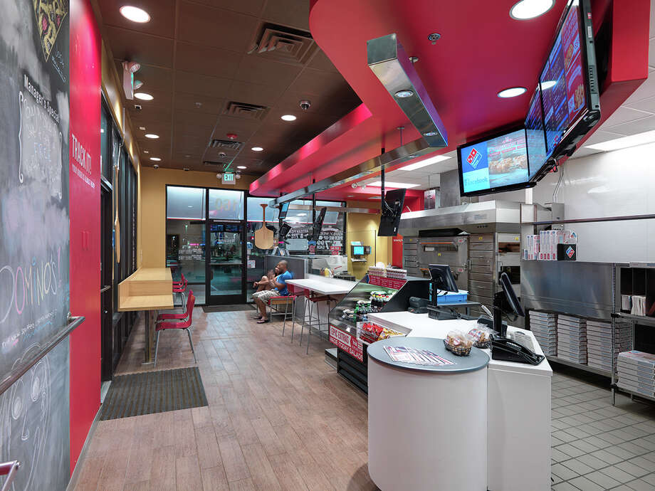 The Interior Of A Dominos Restaurant Features Companys New Pizza Theater Concept Which Includes The Interior Of A Dominos Restaurant Features Companys New Pizza Theater Concept Which Includes