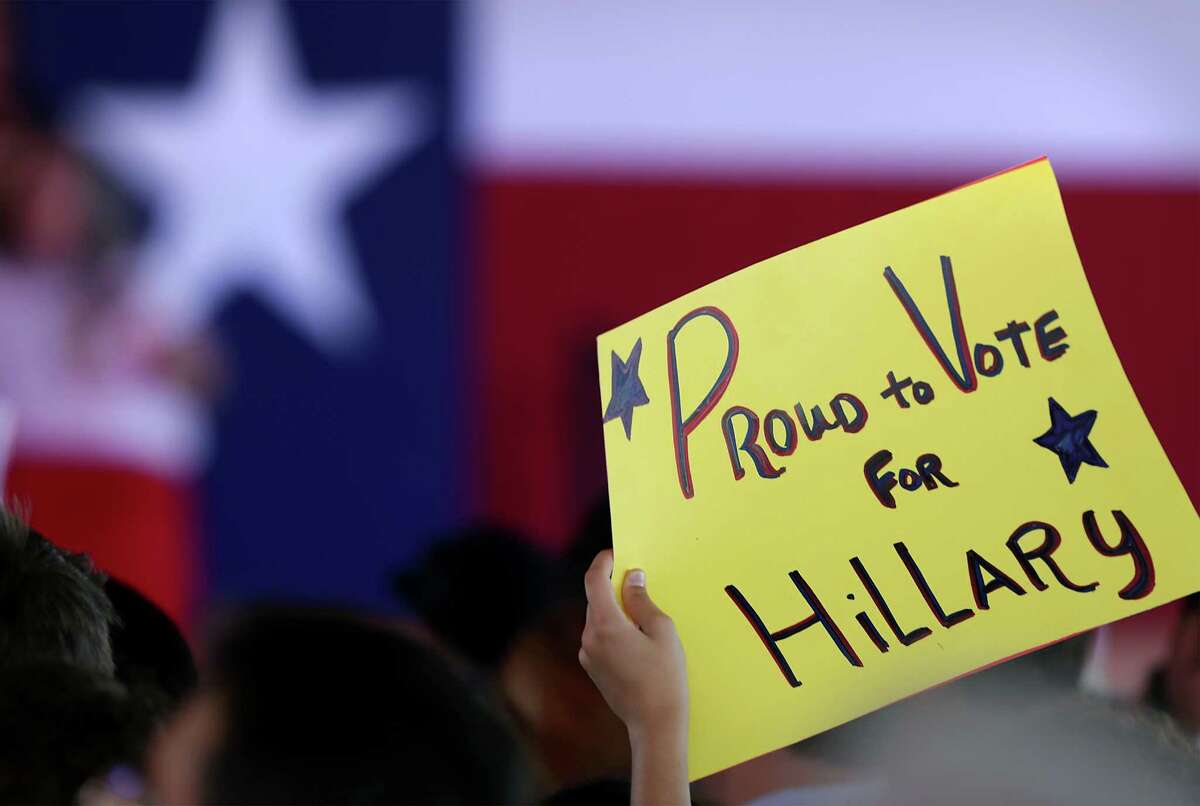 A supporter for Presidential candidate Hillary Clinton holds a sign at a rally on Thursday, Oct. 15, 2015 at Sunset Station in San Antonio.