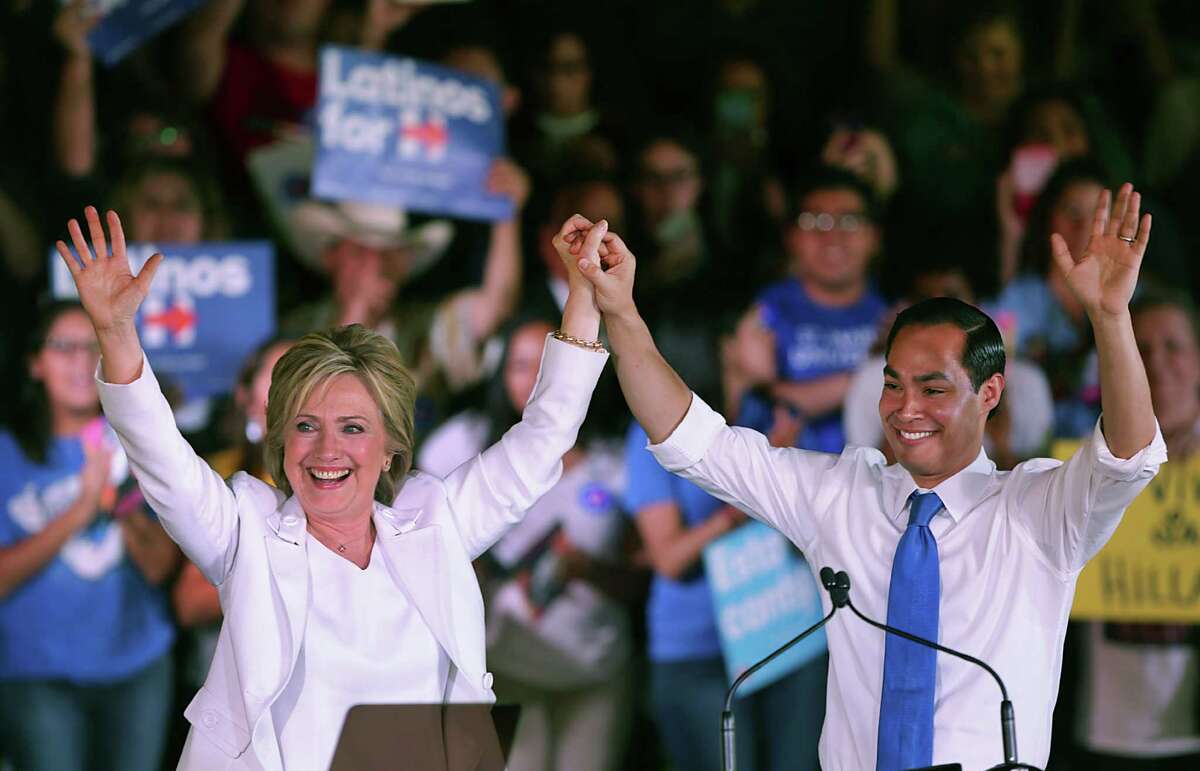 Presidential candidate Hillary Clinton, left, and Housing Secretary Julián Castro, the former mayor, greet supporters at a rally at Sunset Station.