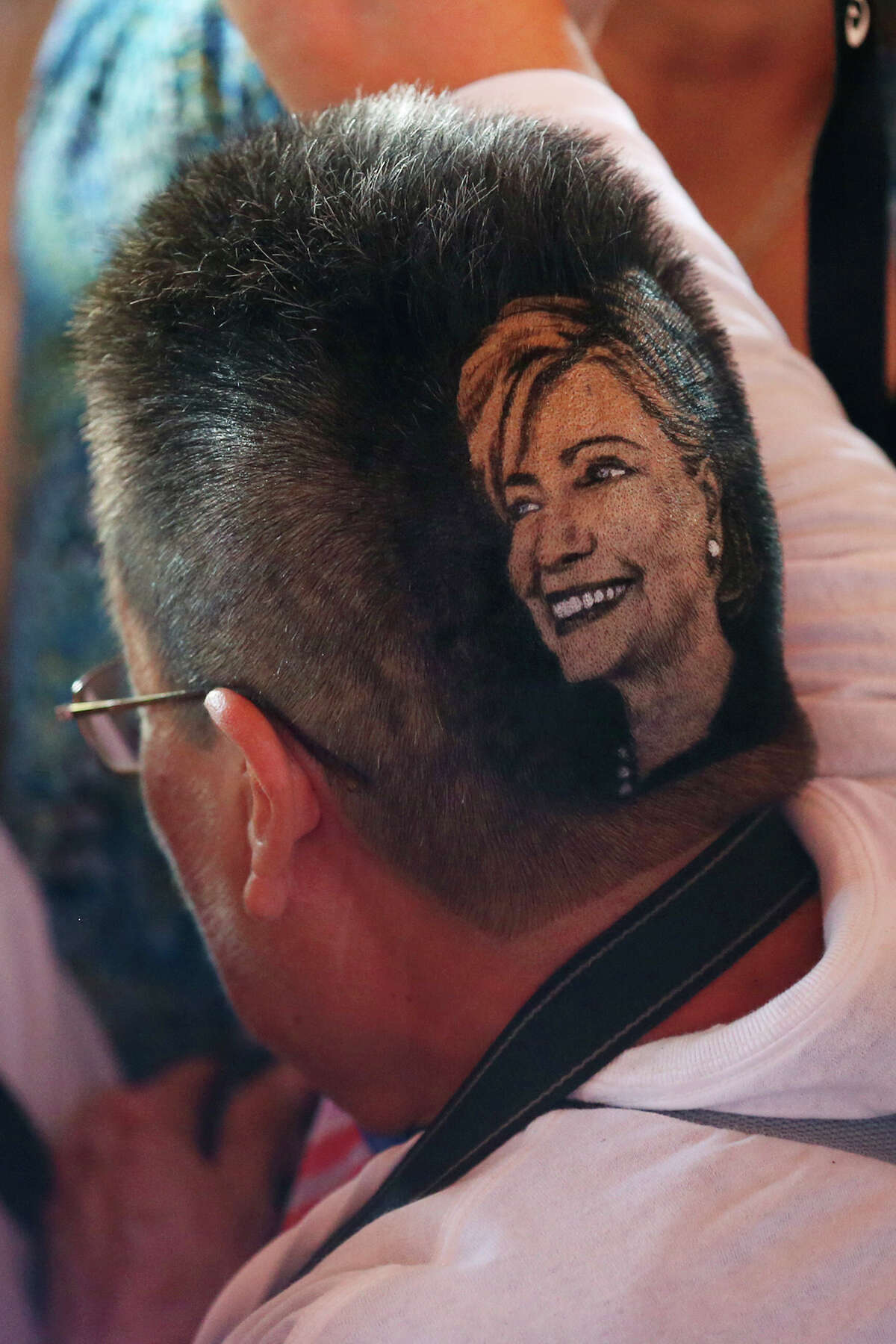 Maria Anita Monsivaiz sports a haircut in Democratic presidential candidate Hillary Clinton’s image during a rally for Clinton at Sunset Station. The crowd numbered in the thousands and was predominately Hispanic. Before the rally, Clinton attended a Q&A session with members of the U.S. Hispanic Chamber of Commerce. The haircut was the design of local barber, Rob the Original.
