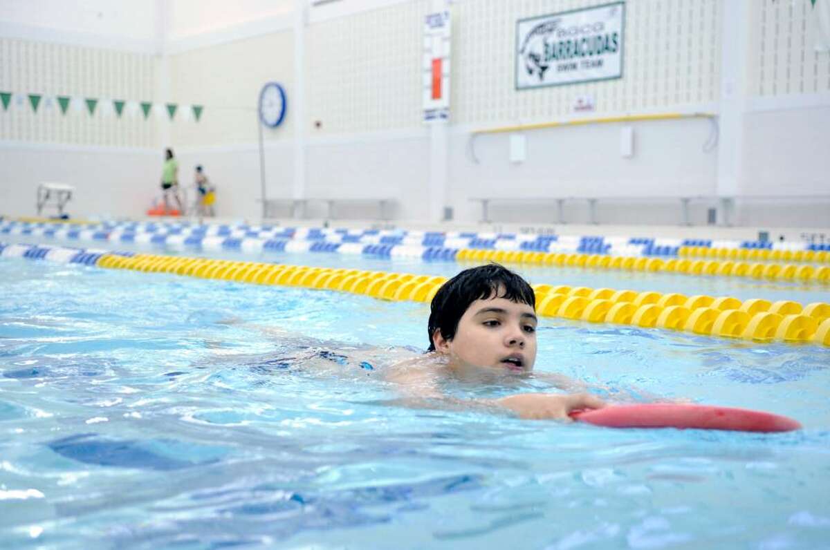 Gianfranco Bellomusto, 10, of Greenwich, works on his kick while swimming in the pool at the Greenwich Boys & Girls Club, Tuesday, March 23rd, 2010. Bellomusto is involved in a social services and Greenwich Boys & Girls Club program aimed at giving kids in low income families an opportunity to learn sailing but first they have to learn swimming and are doing just that in the pool at the Greenwich Boys & Girls Club.