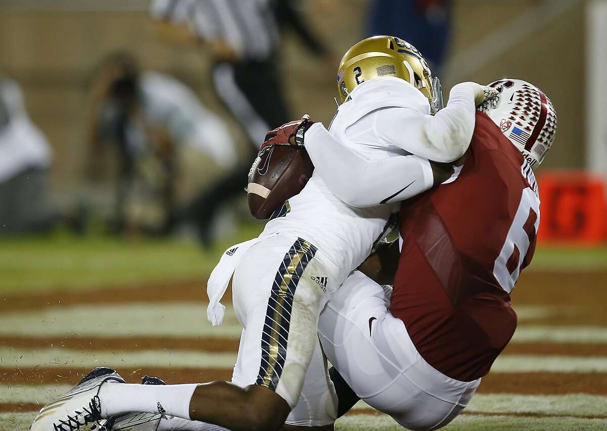 Stanford wide receiver Francis Owusu, right, catches a touchdown pass behind the back of UCLA defensive back Jaleel Wadood during the second half of an NCAA college football game Thursday, Oct. 15, 2015, Stanford, Calif. (AP Photo/Tony Avelar)