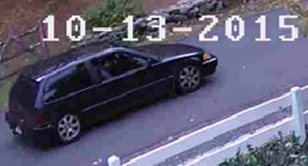 Photos from a surveillance camera show the suspect’s car after a burglary in Roxbury on Tuesday.