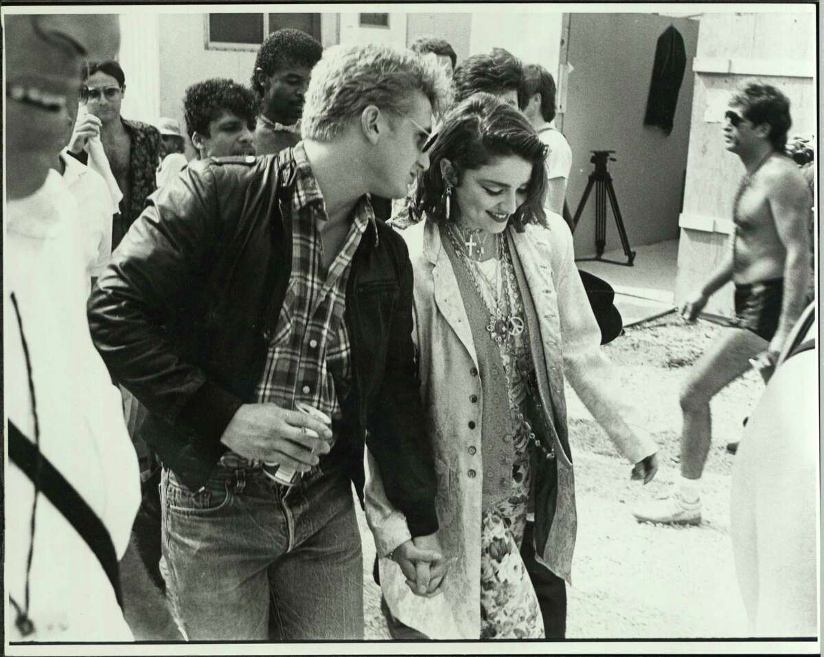American musician Madonna and her fiancee, actor Sean Penn, at John F Kennedy Stadium for Live Aid concert where she performed, Philadelphia, Pennsylvania, July 13, 1985.