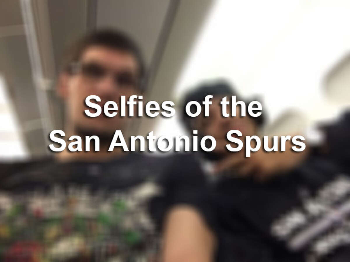 The Spurs posed for selfies with a their new piece of championship jewelry. 