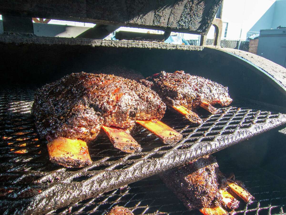Beef ribs line trays in the smoker at Jack's BBQ in Seattle.﻿