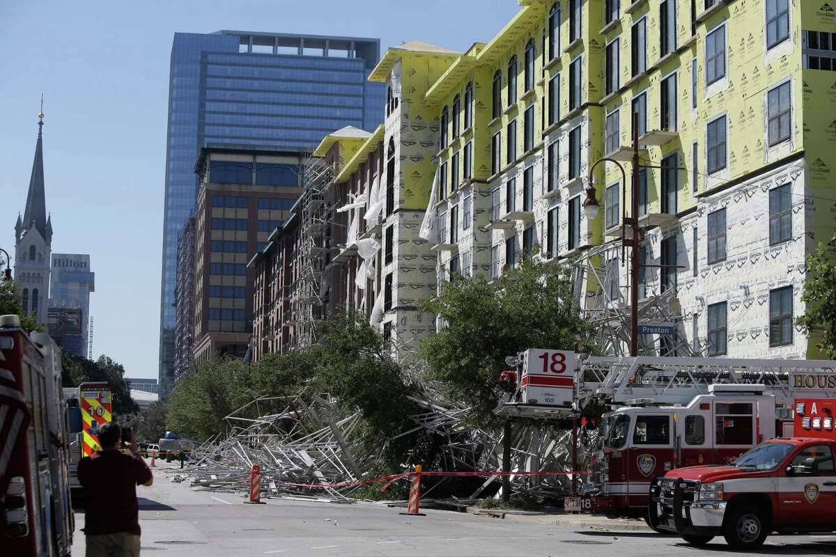 Scaffolding collapsed into the street on Crawford, The accident, which rocked downtown, drew bystanders along with emergency workers.