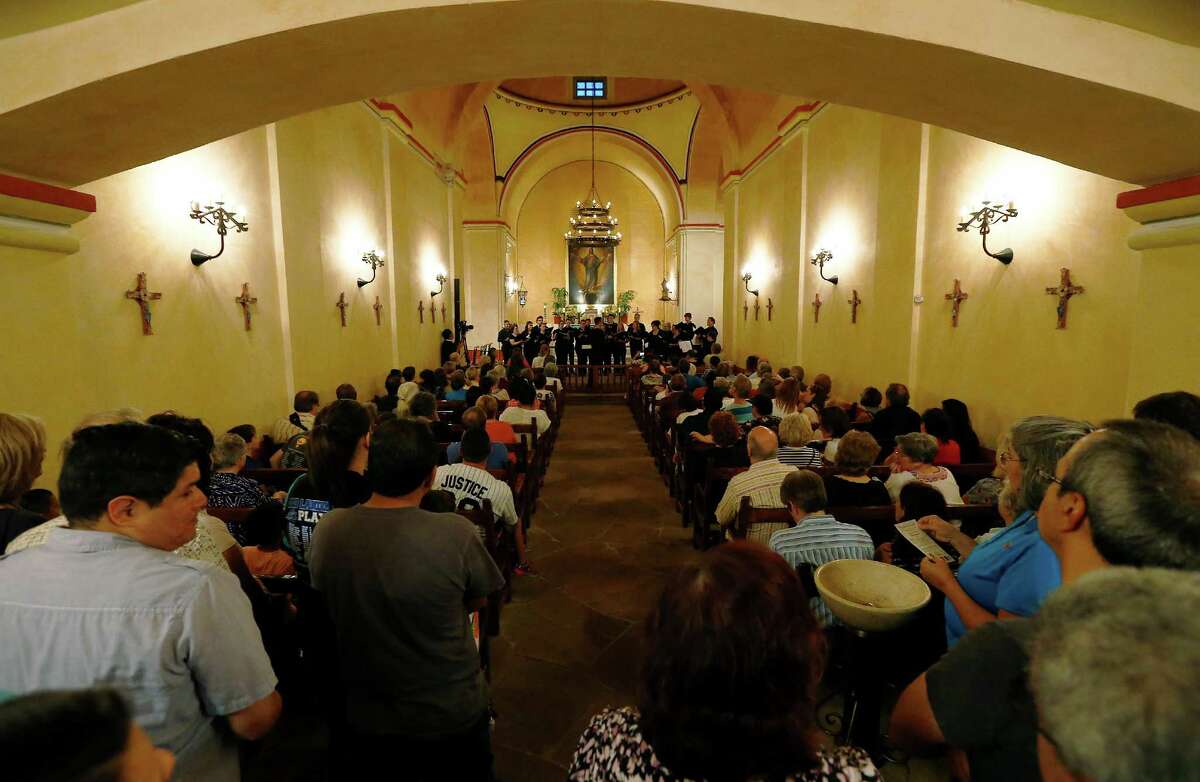 Members of the San Antonio Choral Society perform in the chapel of Mission Concepcion as part of the World Heritage Site Celebrations on Friday, Oct. 16, 2015. The San Antonio Office of Historic Preservation hosted the event featured a light projection on the mission of how it originally looked according to officials. Guests were also treated to tours around the mission, music and food.