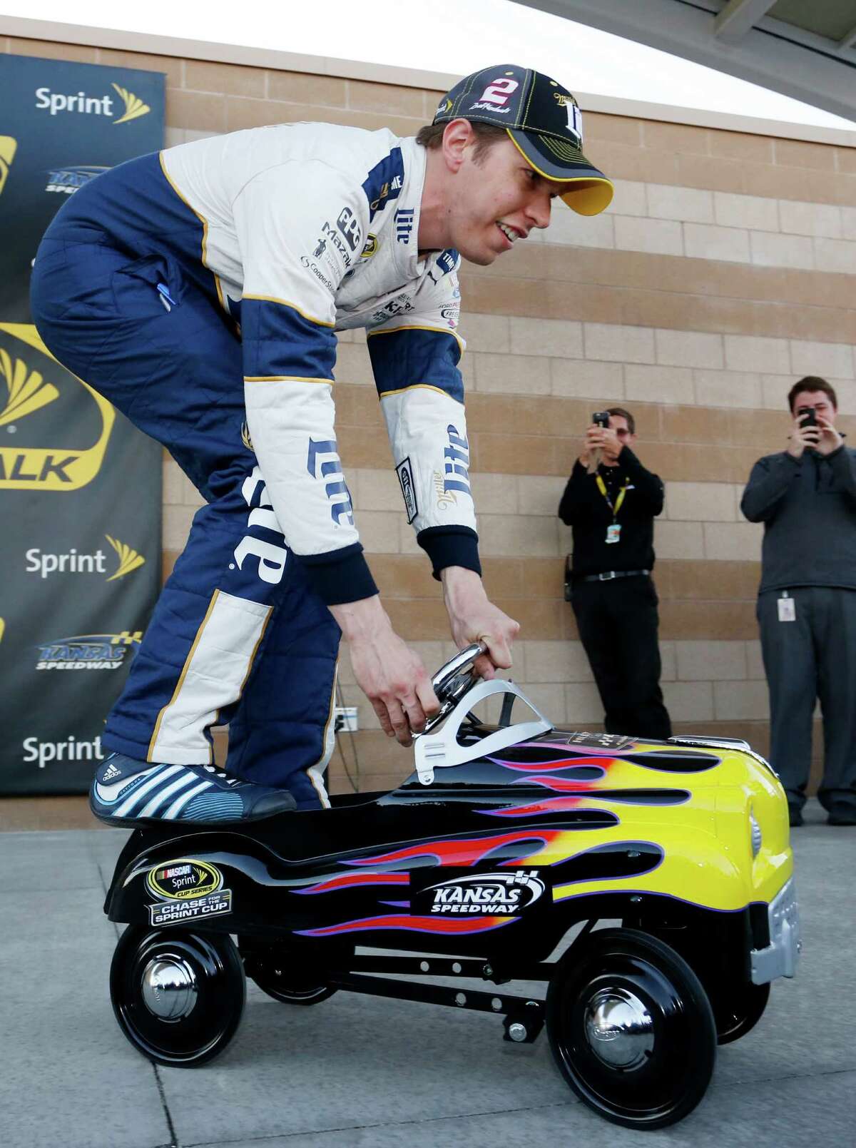 Brad Keselowski takes the pole award for a spin Friday after qualifying first for Sunday's Sprint Cup Series race at Kansas Speedway in Kansas City, Kan.