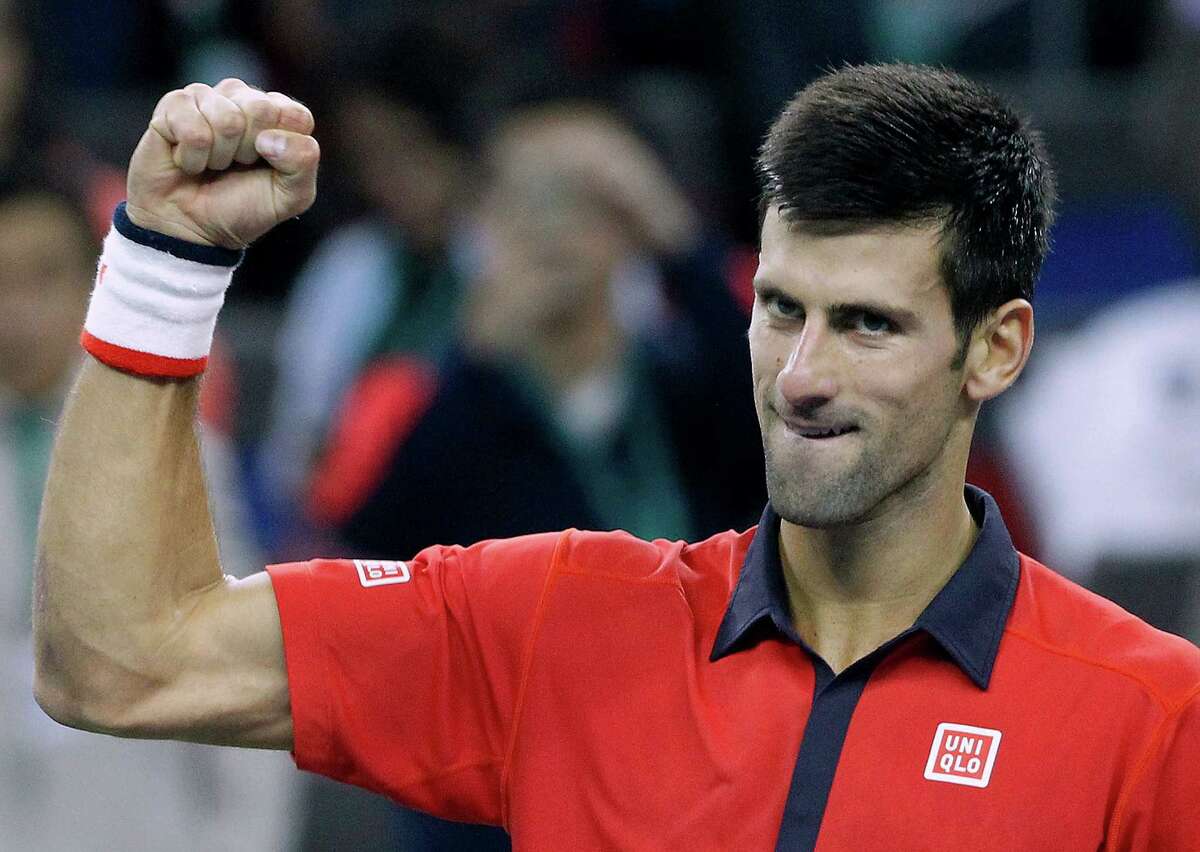 Novak Djokovic of Serbia celebrates after winning his semifinal match against Andy Murray of Britain in the Shanghai Masters tennis tournament in Shanghai, China, Saturday, Oct. 17, 2015. (AP Photo) ORG XMIT: XAW143