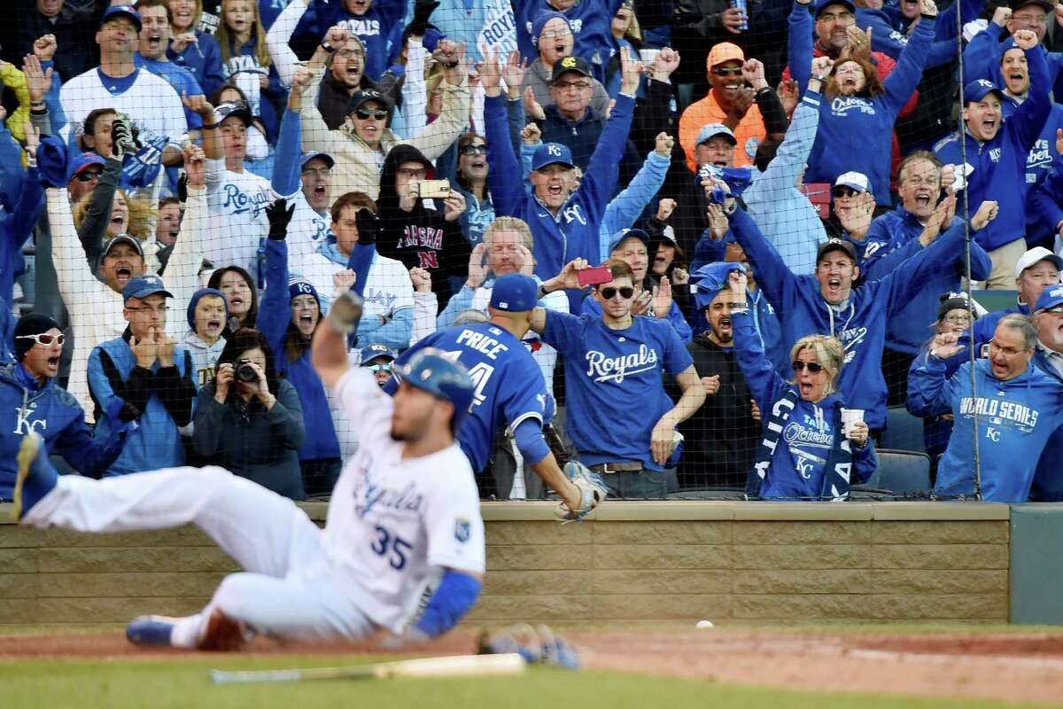 Kansas City fans cheer as Eric Hosmer becomes part of the Royals' five-run seventh against the Blue Jays.﻿