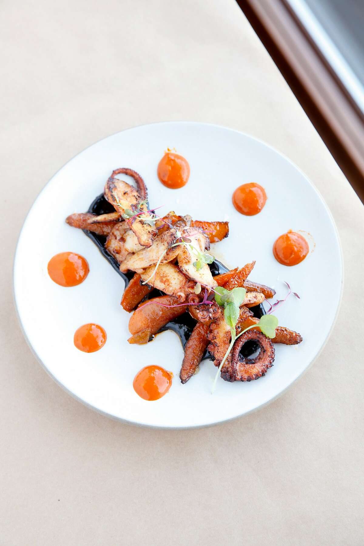 The seared octopus with roasted baby carrots, mojo picon and a black garlic aioli at Zuzu in Napa, Calif., on Thursday, October 15, 2015.