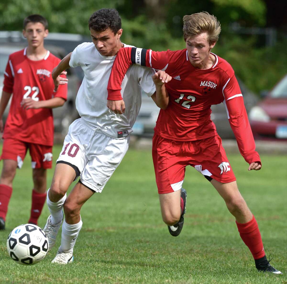 FILE PHOTO: Bethel's Frank Musser (10) and Masuk's Michael Snajder (12) battle for the ball in the boys high school soccer game between Masuk and Bethel high schools on Saturday, September 26, 2015, at Rourke Field, in Bethel, Conn.