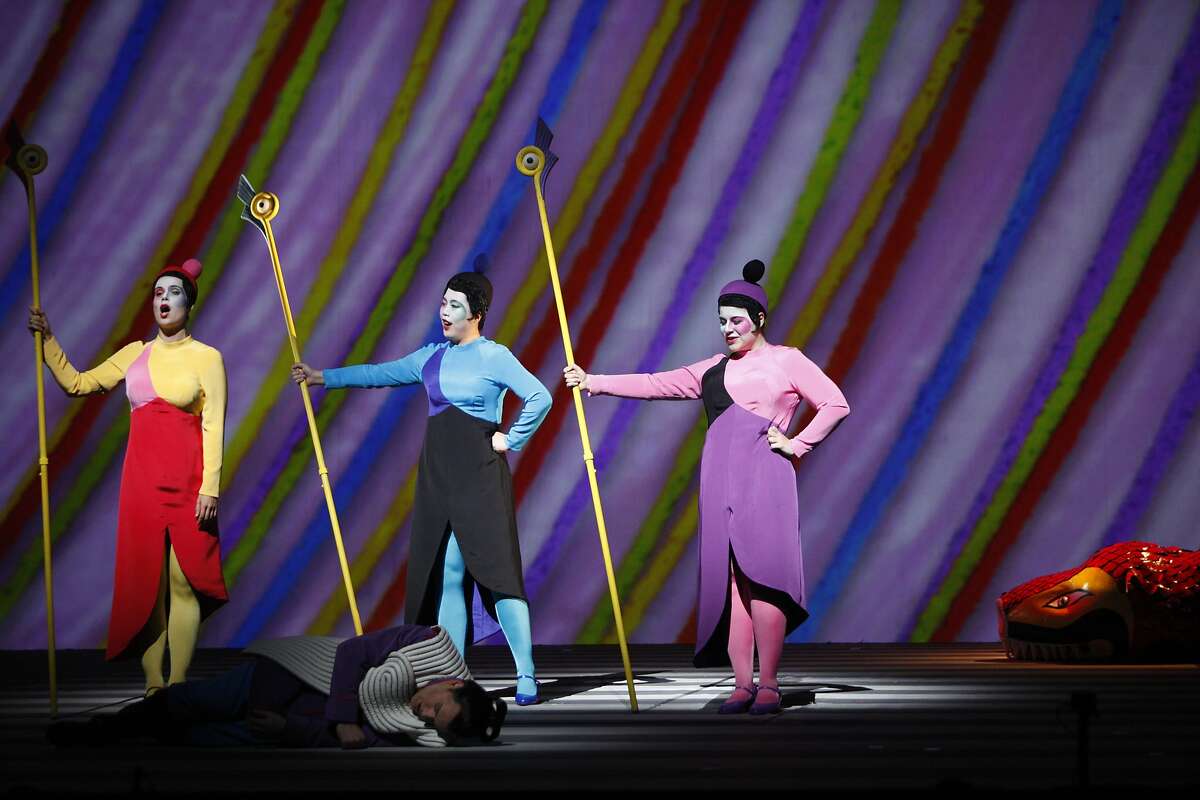 The Three ladies, left to right, Zanda Svede, Nian Wang and Jacqueline Piccolino, stand over Paul Appleby as Tamino, during the dress rehearsal of Wolfgang Amadeus Mozart's The Magic Flute at the War Memorial Opera House on October 17, 2015.