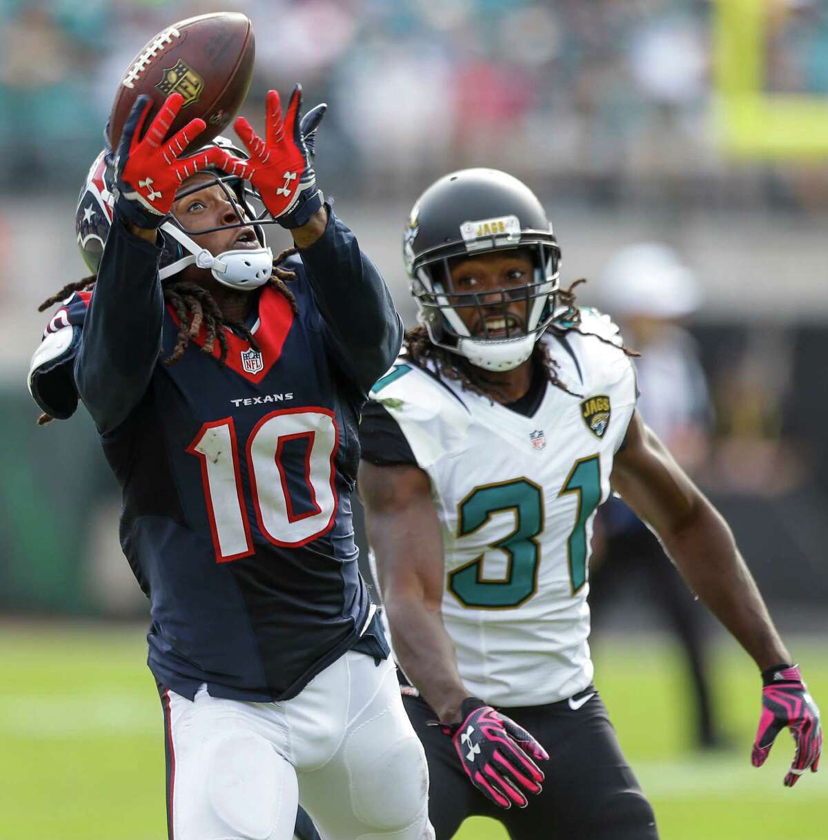 Texans receiver DeAndre Hopkins hauls in a pass from Brian Hoyer despite the efforts of Jaguars cornerback Davon House in the fourth quarter. On the day, Hoyer and Hopkins took it to Jacksonville 10 times for 148 yards and two touchdowns, with both TDs coming in the fourth quarter.