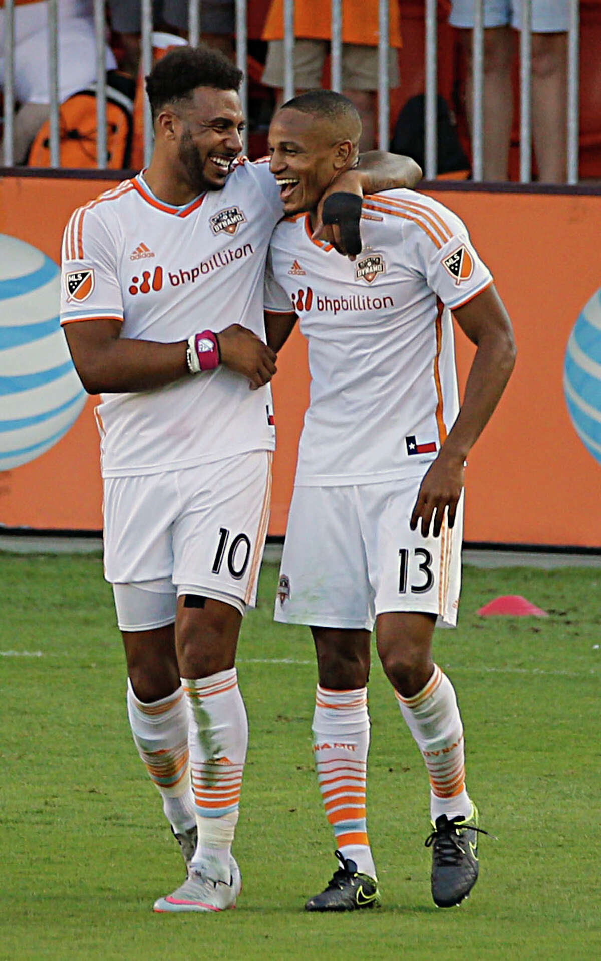 Houston Dynamo forward Giles Barnes left, celebrates with Dynamo midfielder Ricardo Clark right, after Clark's goal during the second half of MLS game action at BBVA Compass Stadium Sunday, Oct. 18, 2015, in Houston.