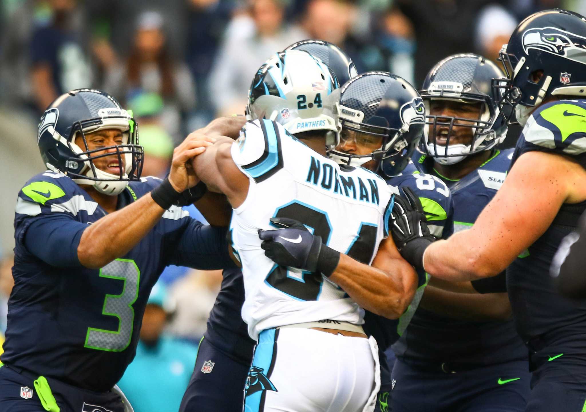 Carolina Panthers quarterback Cam Newton (1) walks off the field after  throwing an interception to Seattle Seahawks safety Kam Chancellor in the  fourth quarter during NFC Divisional Playoff action at CenturyLink Field