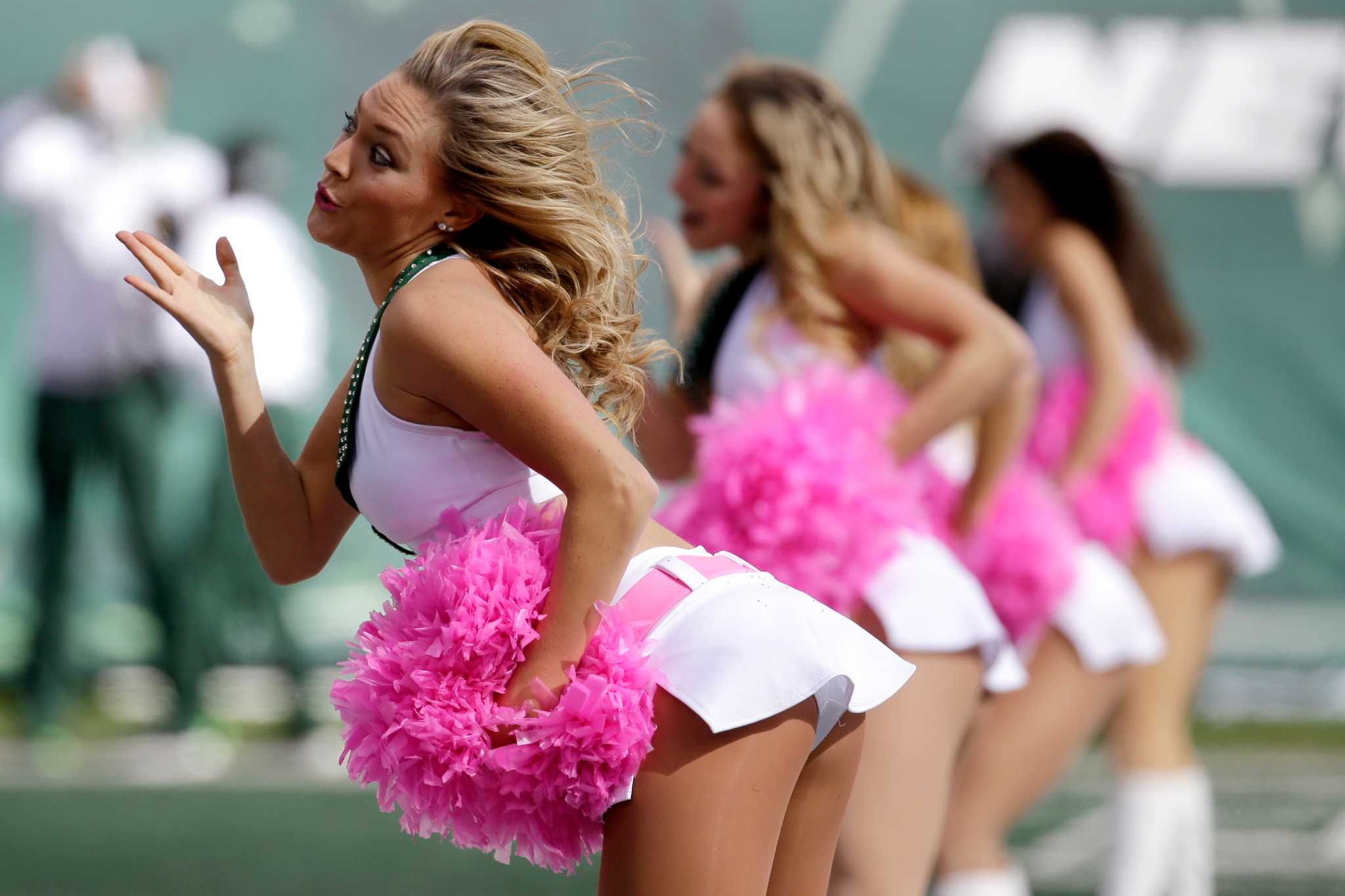 Seattle Seahawks cheerleaders pink pom,poms awareness.