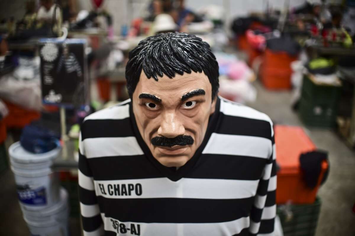 A costume and a mask representing Mexican drug trafficker Joaquin Guzman Loera, aka "El Chapo", are pictured in a factory. See the 12 things you need to know about El Chapo's cartel.