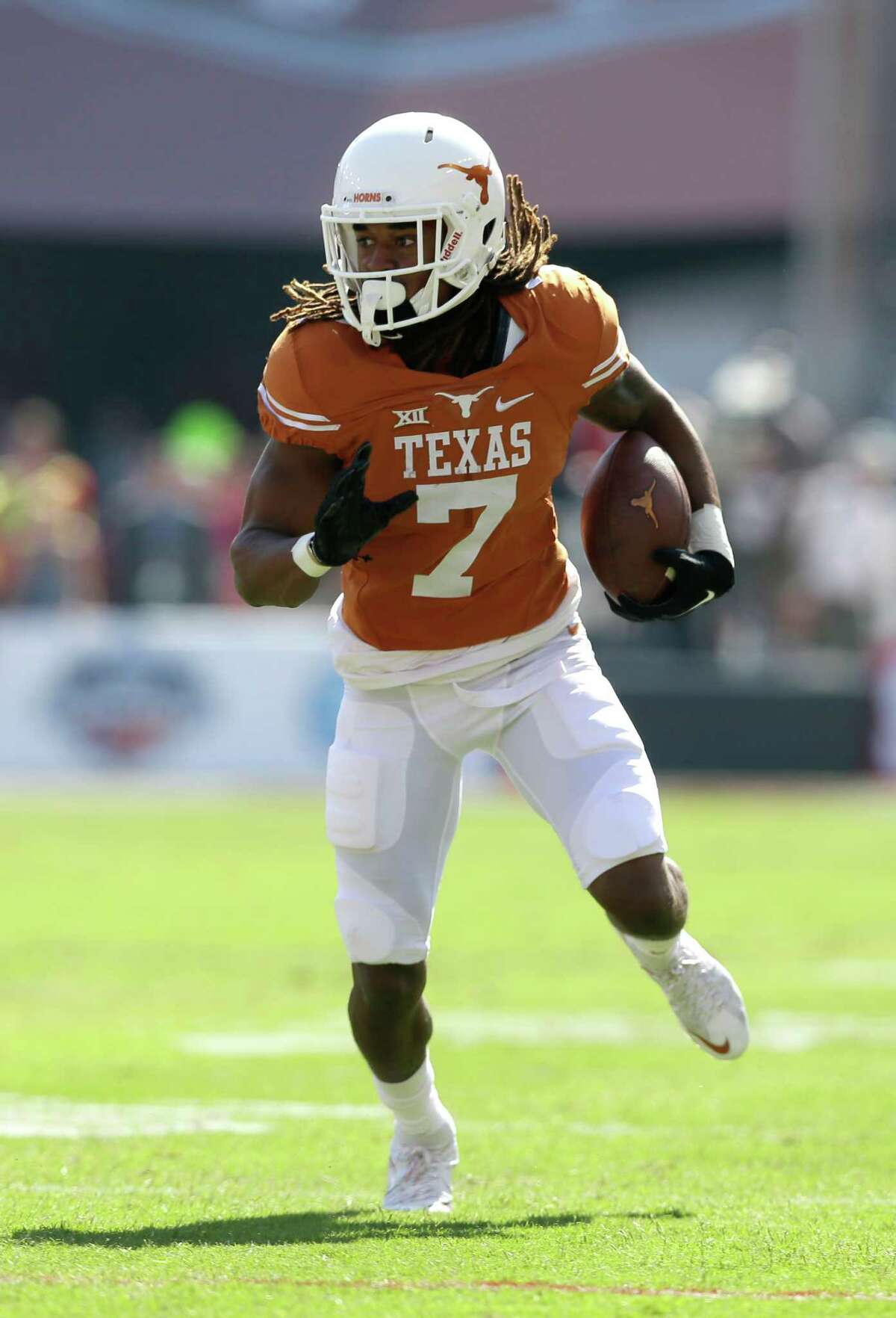 Texas wide receiver Marcus Johnson (7) looks for running room in an NCAA college football game against Oklahoma Saturday, Oct. 10, 2015, in Dallas. (AP Photo/LM Otero)