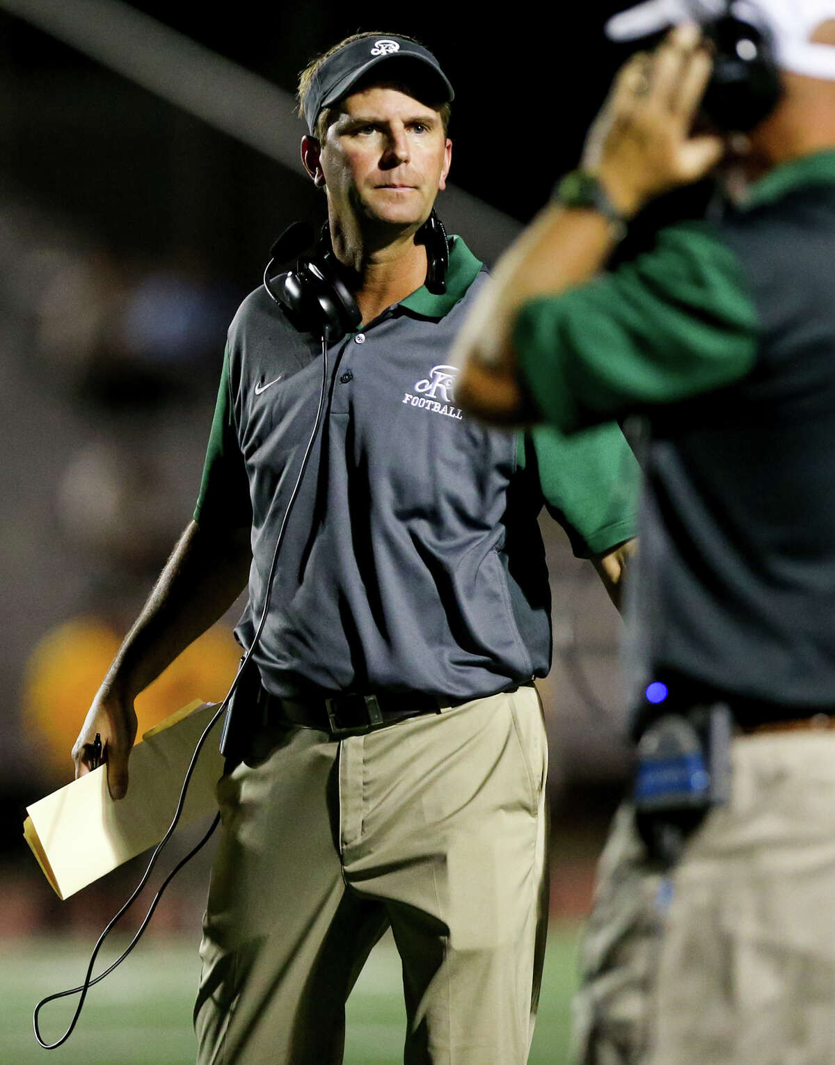 Reagan coach David Wetzel on the sideline during the second half of their game with East Central at Comalander Stadium on Saturday, Sept. 19, 2015.