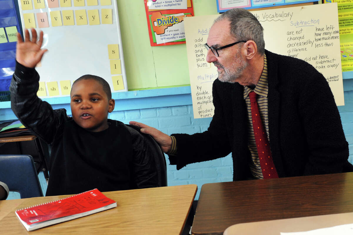 Architect Thom Mayne listens as Jordan Hill, a 3rd grader answers a question at Hall School, left inset. Mayne will be the visiting artist this school year at Hall, part of the national Turnaround Arts program.