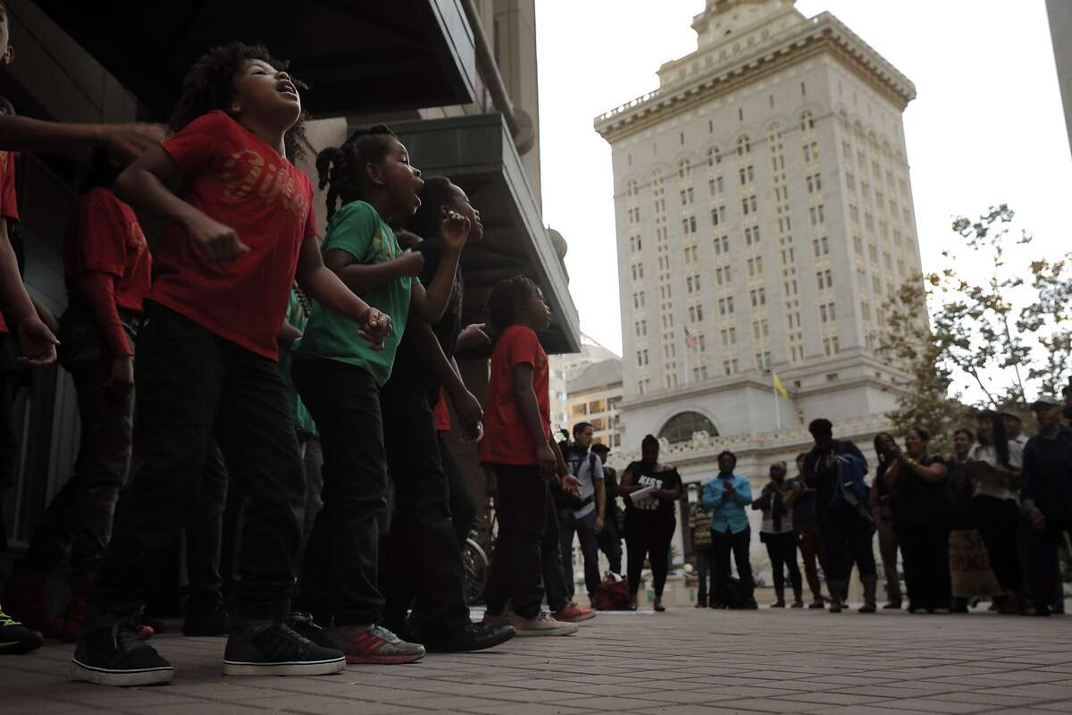 Members of the childrens' group, "Young, Gifted and Black," perform during a rally organized by Oakland's Creative Neighborhood Coalition to defend Oakland's culture on Monday night. The rally preceded a meeting the city held to redesign downtown in Oakland, Calif., on Monday, October 19, 2015.