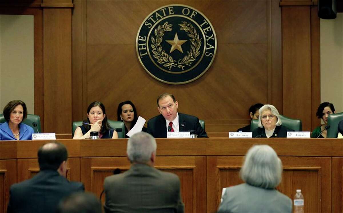 In July, state Sen. Charles Schwertner, R-Georgetown, center, questions witnesses during a Texas Senate Health and Human Services Committee hearing on Planned Parenthood videos covertly recorded that target the abortion provider in Austin, Texas. Texas announced Monday that it was cutting off Medicaid funding to Planned Parenthood clinics.