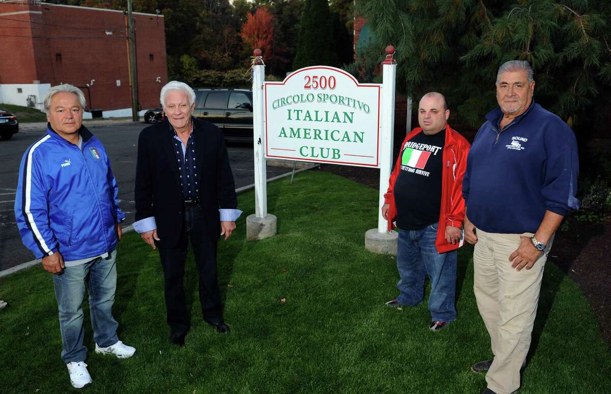 Former Bridgeport Mayor Len Paoletta, second from left, poses in front of the Circolo Sportino Italian American Club in Bridgeport, Conn. on Tuesday October 20, 2015. PFrom left to right is club Vice-President Sandro Pizzicarola, Paoletta, club member Frankie Marcoccia, and club President Peter Prizio.