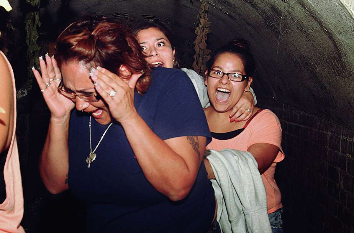 A hidden camera caught local scare-seekers laughing (and crying) in the face of death at the 13th Floor Haunted House in San Antonio.