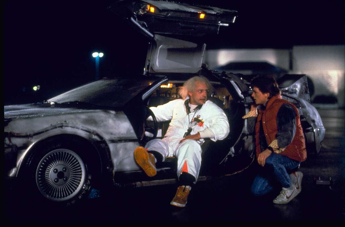 FILE - This file photo provided by Universal Pictures Home Entertainment shows Christopher Lloyd, left, as Dr. Emmett Brown, and Michael J. Fox as Marty McFly in the 1985 film, "Back to the Future." Wednesday's so-called "Back to the Future" Day marks the date: Oct. 21, 2015, that characters McFly, Brown and Jennifer Parker famously journeyed to the future in the film trilogy's second installment in 1989. In recognition of the day, Austria's transport ministry is ready with guidelines for hoverboards, and has issued tongue-in-cheek rules on their use to mark “Back to the Future” day.