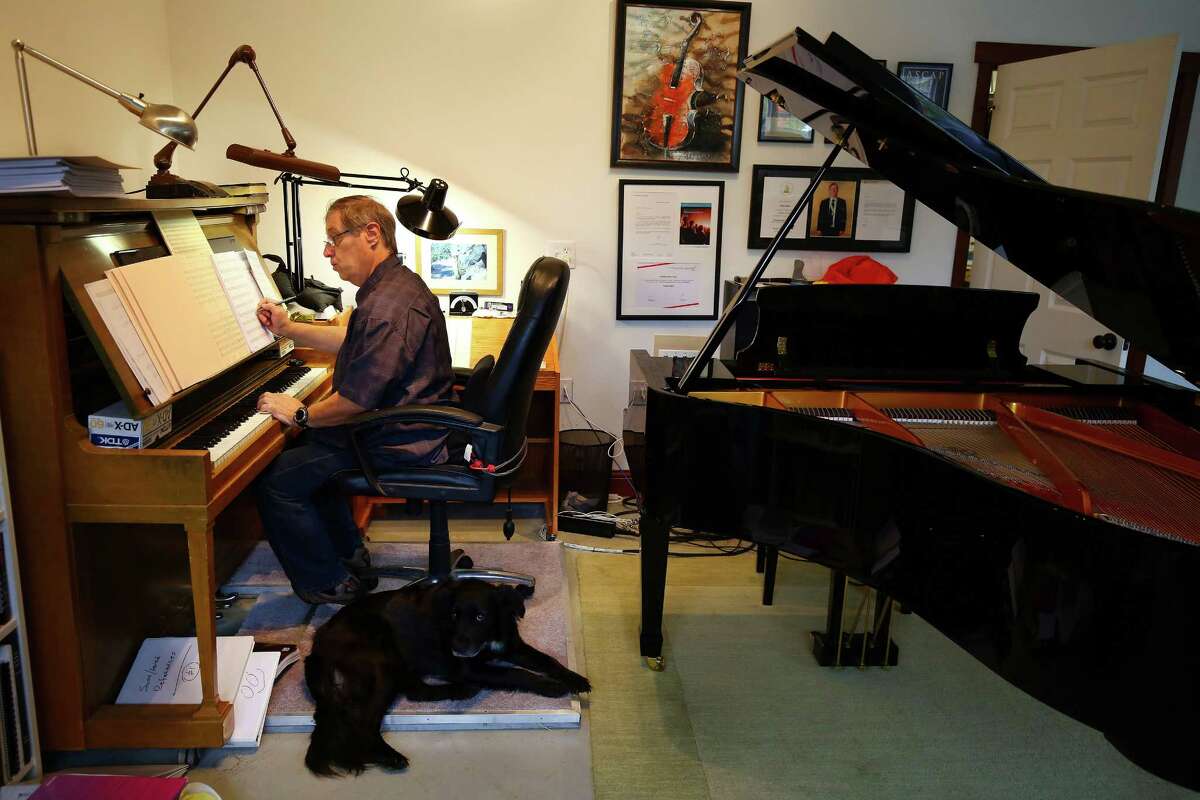 Composer Ron Jones writes music in his new studio in Stanwood, Wa., Tuesday, Oct. 20, 2015. He moved to Stanwood in January from L.A. where he worked on such tv shows as Star Trek: The Next Generation and Family Guy. Jones opened up SkyMuse Studios this year and hopes it will be a place for musicians and composers to collaborate and grow together.