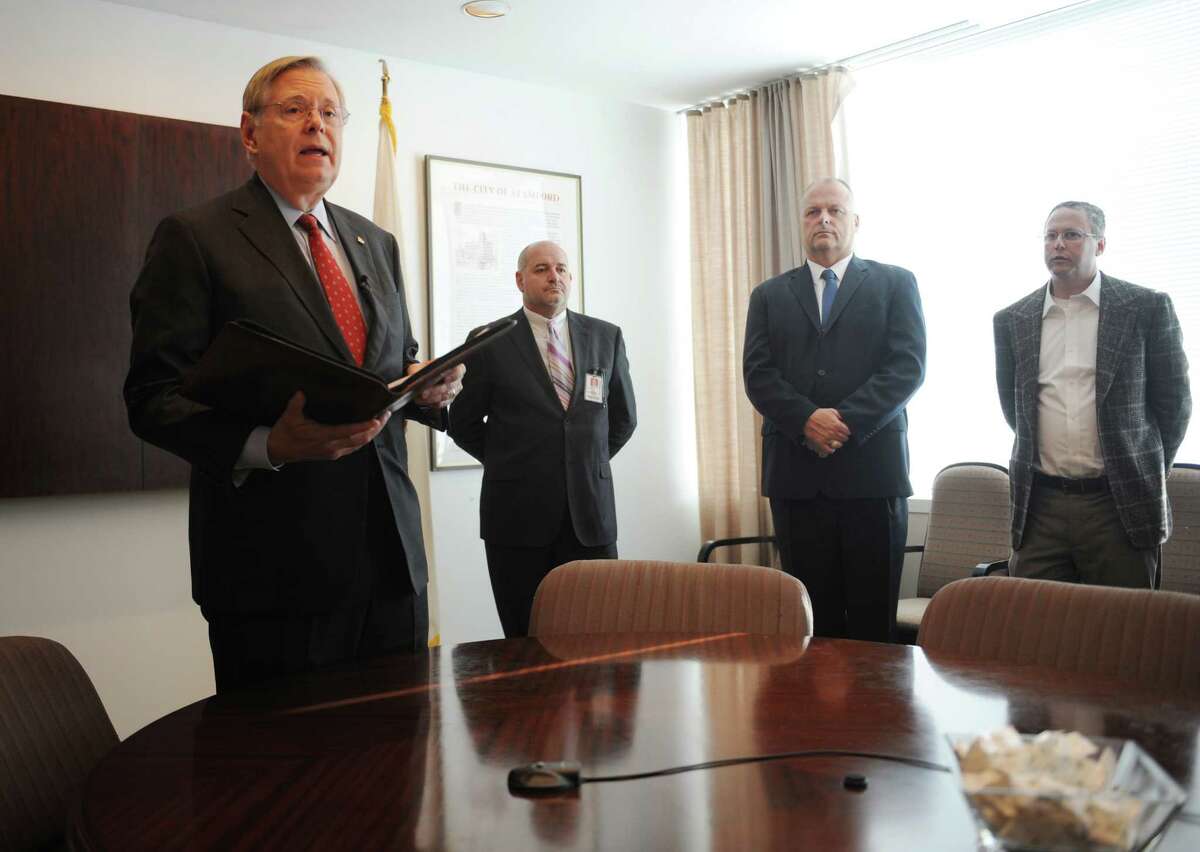 Stamford Mayor David Martin, left, speaks about the anticipated closure of The Smith House nursing home during a press conference at the Government Center in Stamford, Conn. Wednesday, Oct. 21, 2015. On Tuesday, the city requested a Certificate of Need package in order to close The Smith House nursing home. Mayor Martin says the financial losses are unsustainable and there are beds in surrounding facilities to accomodate residents. It is now up to the state to grant or deny to city's request to close the nursing home.