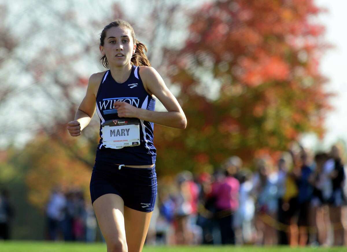 Wilton’s Mary Lynch finishes second at Wednesday’s FCIAC girls cross country championships at Waveny Park in New Canann.