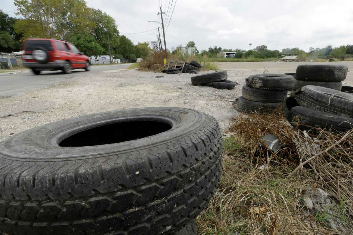 Tires are discarded along Laura Koppe Road at Jensen Street, one of thousands of illegal dumps.