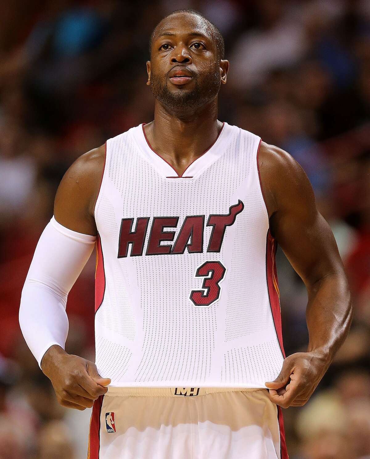 MIAMI, FL - OCTOBER 21: Dwyane Wade #3 of the Miami Heat looks on during a preseason game against the Washington Wizards at American Airlines Arena on October 21, 2015 in Miami, Florida. NOTE TO USER: User expressly acknowledges and agrees that, by downloading and/or using this photograph, user is consenting to the terms and conditions of the Getty Images License Agreement. Mandatory copyright notice: (Photo by Mike Ehrmann/Getty Images)