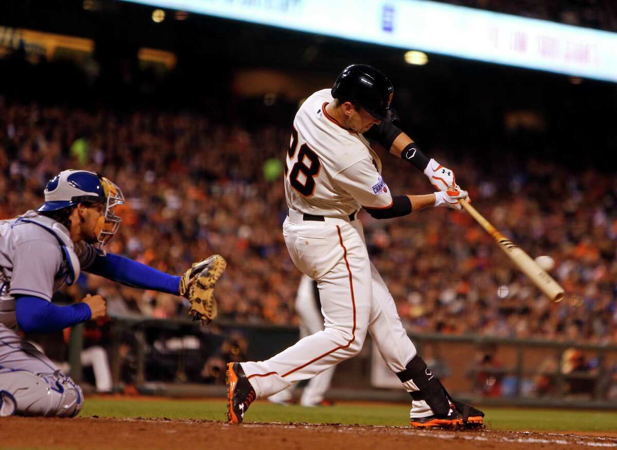 Buster Posey hits an RBI single in the third inning against the Los Angeles Dodgers at AT&T Park on April 21.