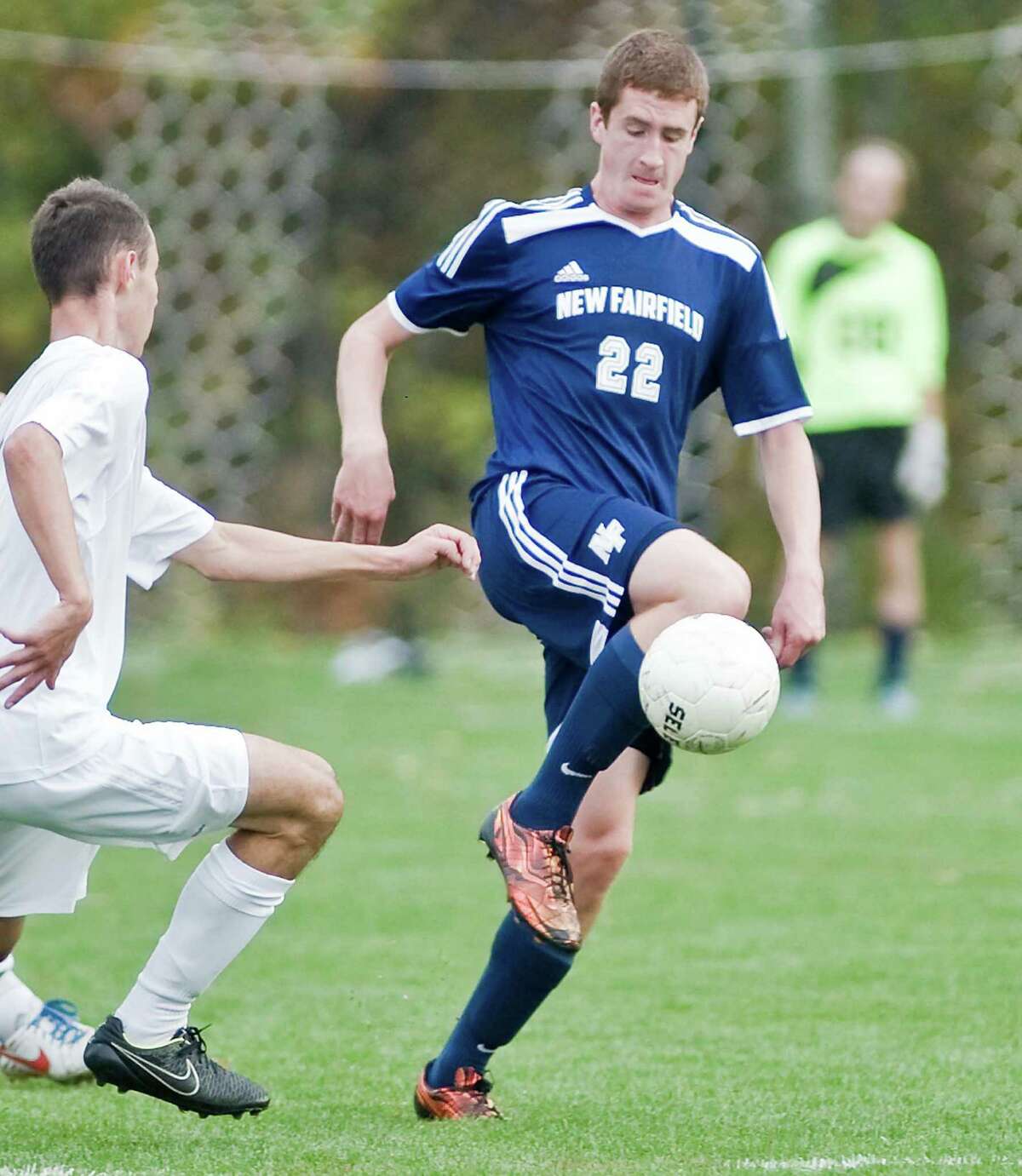New Fairfield High School’s Liam Hanley tries to settle the ball during a game against Joel Barlow High School, played at Barlow. Oct. 22, 2015