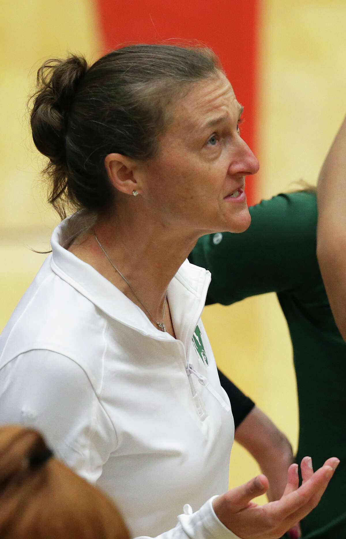 Incarnate Word coach April Fricke talks during a timeout as Antonian wins the TAPPS 2-5A volleyball title by beating Incarnate Word High School 3-0 at Littleton Gym on October 22, 2015.